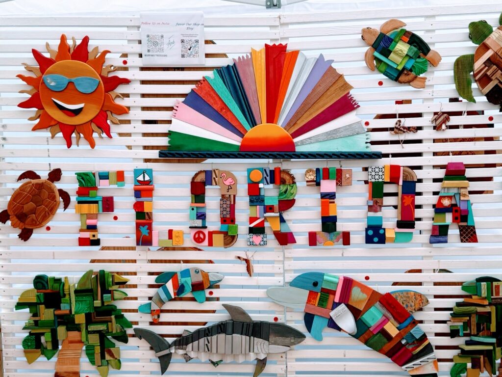 Florida Web Design Company | Crafting Websites Since 2008 Colorful handcrafted wooden art symbolizing creativity and innovation in web design, displayed at a Florida-based web development agency.